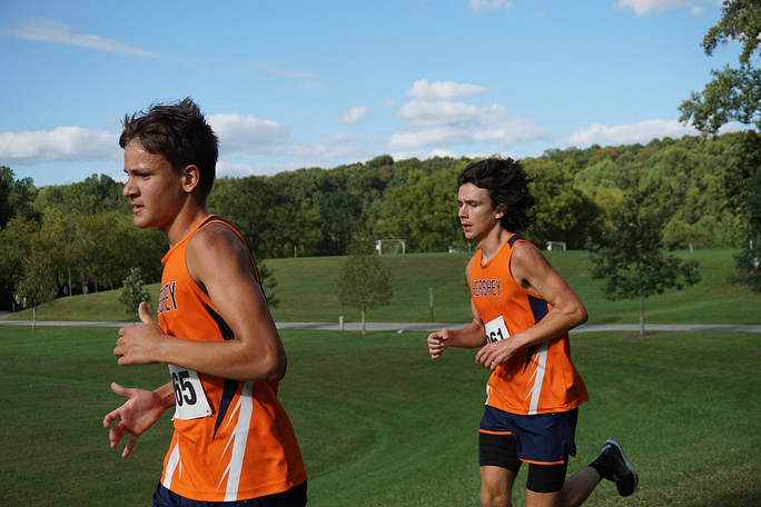 Freshman Max Hulays and junior Will Chappell run during the tri-meet against Palmyra and Cedar Cliff.  Hulays was fourth for the Trojans with 17:56 and Chappell was sixth with 17:57.  