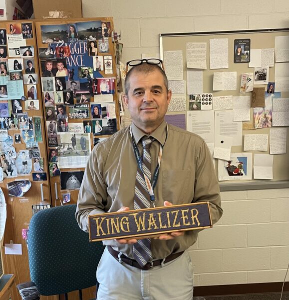 HHS math teacher, John Walizer, poses with his customized name plate. Mr. Walizer has been teaching at Hershey for 26 years. 

