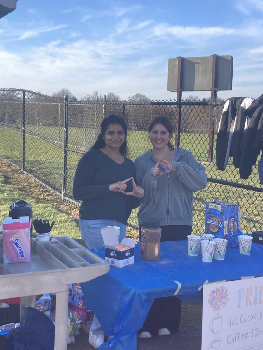 Seniors Shiza Saad and Maggie Dye pose for a picture. They ran a hot drinks stand to raise money for Four Diamonds, an organization focused on fighting childhood cancer.