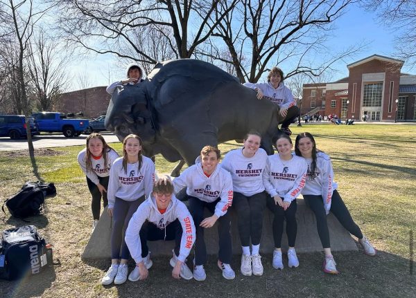 HHS Swimming poses by the Bucknell Bison after their first day of competing. The team took 9 swimmers to the meet, and had a successful week (Natalie Colarossi/HHS Broadcaster).

