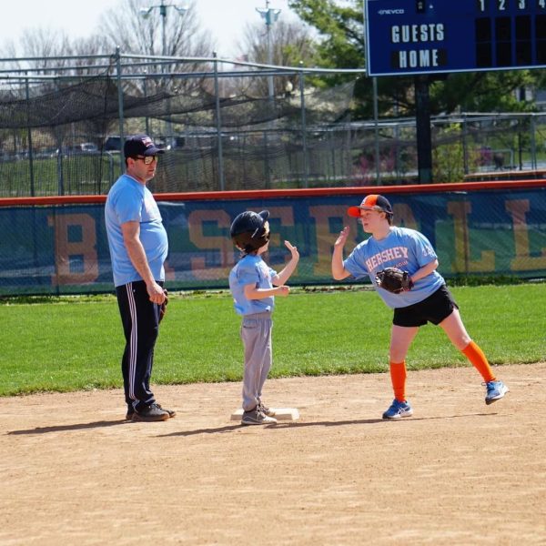 Pictured are players of the Hershey Challengers Baseball League high-fiving each other. Come support the team on June 2nd for the Annual Challenger Day at Hershey Baseball Fields. (Broadcaster/Christina Lengle).
