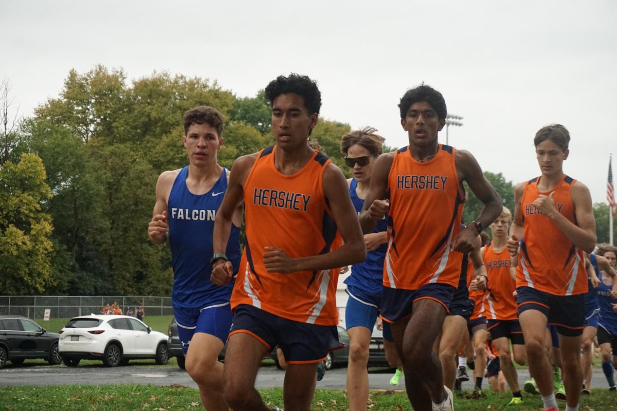 Seniors Vinay Raman and Jacob Abraham and sophomore Max Hulays lead the race against Lower Dauphin and Cedar Cliff.  Raman, Abraham, and Hulays took the top three spots in the race.  (Broadcaster/Robert Sterner)