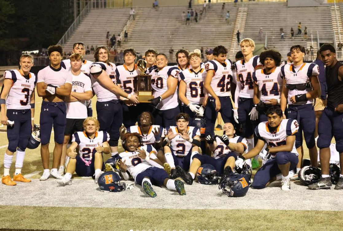 Trojans pose for a team photo after winning against Milton Hershey. They defeated the Spartans for their first game of the season. (DTSD) 
