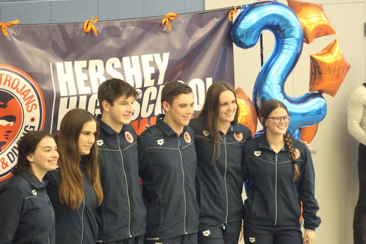 Hershey High School Swimming and Diving Team Seniors stand together for the photographer. The group of athletes assisted Hershey’s sweep over Chambersburg; Women’s 103-82 and Men’s 109-77. (Tayen Parke/The Broadcaster)
