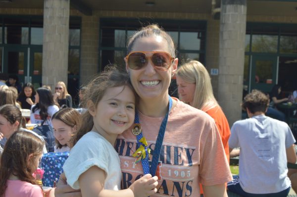 Principal Mrs. Schmidt arrived with five year old Monroe. Monroe assisted her mother with Breakfast Buddies, supervising the halls, and riding the “Gator” (utility vehicle). (Tabitha Pecchio/The Broadcaster)
