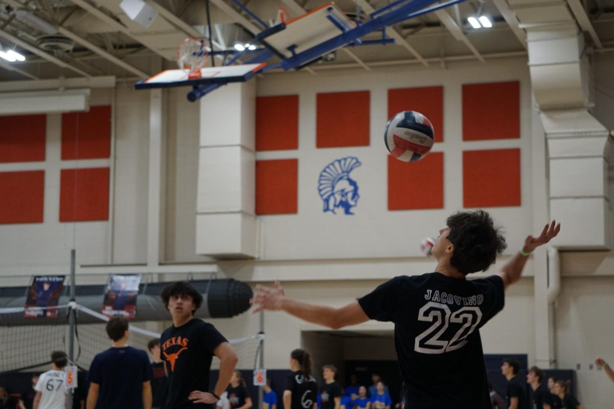 Sawyer Hausknecht serves the ball to start another game against opposing team. 