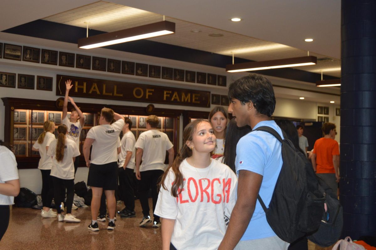 Sophomores and freshmen teams gather outside the gym for the afternoon portion of the volleyball tournament.