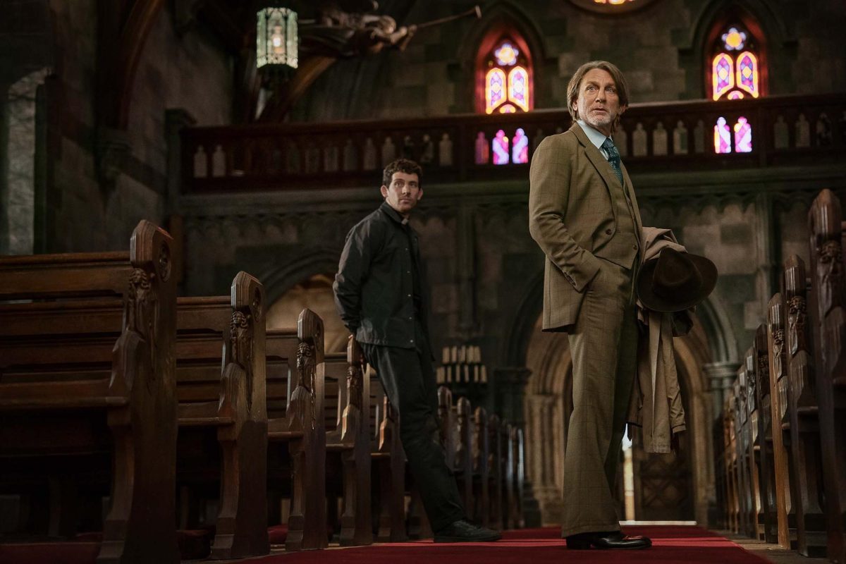 Josh O’Connor is priest Jud Duplenticy and Daniel Craig is Benoit Blanc in Wake Up Dead Man, the third installation in the Knives Out series. The movie  premiered at the Toronto International Film Festival on September 6, 2025. (Warner Bros.)