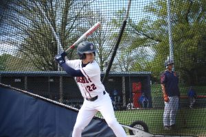 Team captain Bennett Sheppard warms up in the batting cage before the Varsity Baseball game against the Falcons on Tuesday, April 19. The shortstop has an overall fielding percentage of .917 this season, which is above the national average of .858. (Broadcaster/Gavin Zeigler).