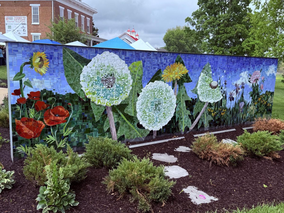 The signature artfest mural being showcased on a wall. This was located at the front entrance facing the parking lot. The event ran for one day and was sunny for most of my time there. (HHS Broadcaster/Sydney Keeler)
